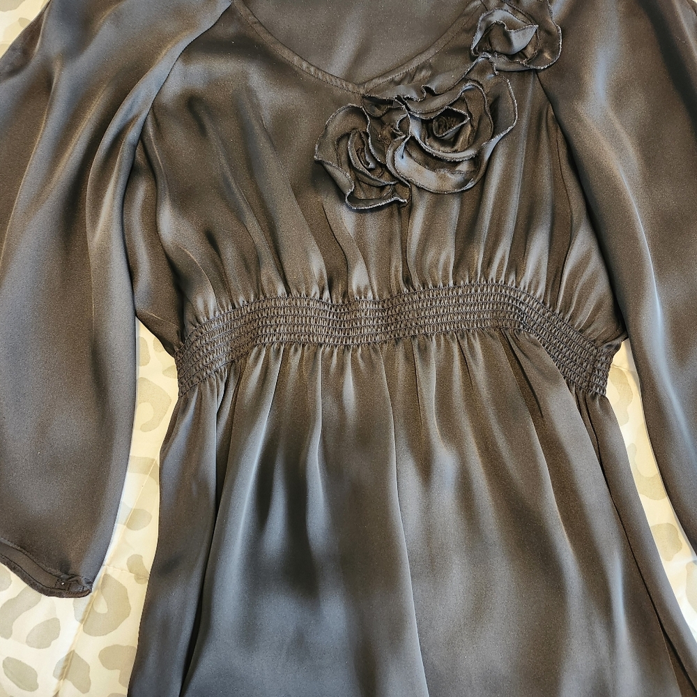 A silky blouse in black by  Spense in 100% polyester. Size L.